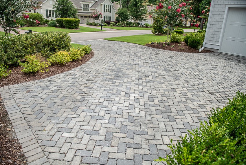 Herringbone pattern paver driveway with decorative borders